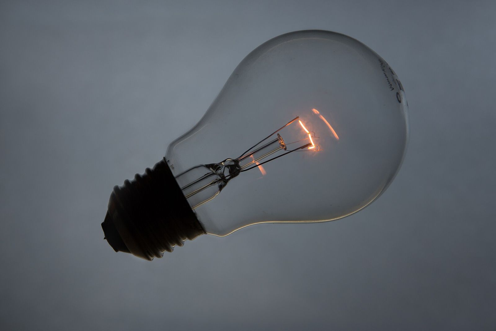 A clear A60 bulb on grey