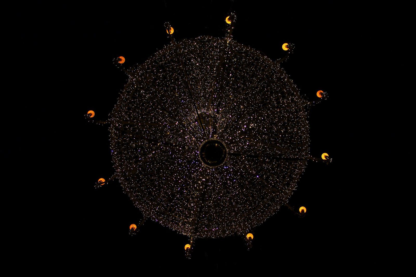 A ring of light points on a dark ceiling